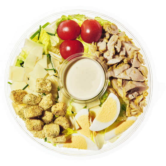 Foto van Healthy Hand Salade caesar op witte achtergrond